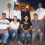 Group photo of ten people at a gathering, smiling in a casual setting.